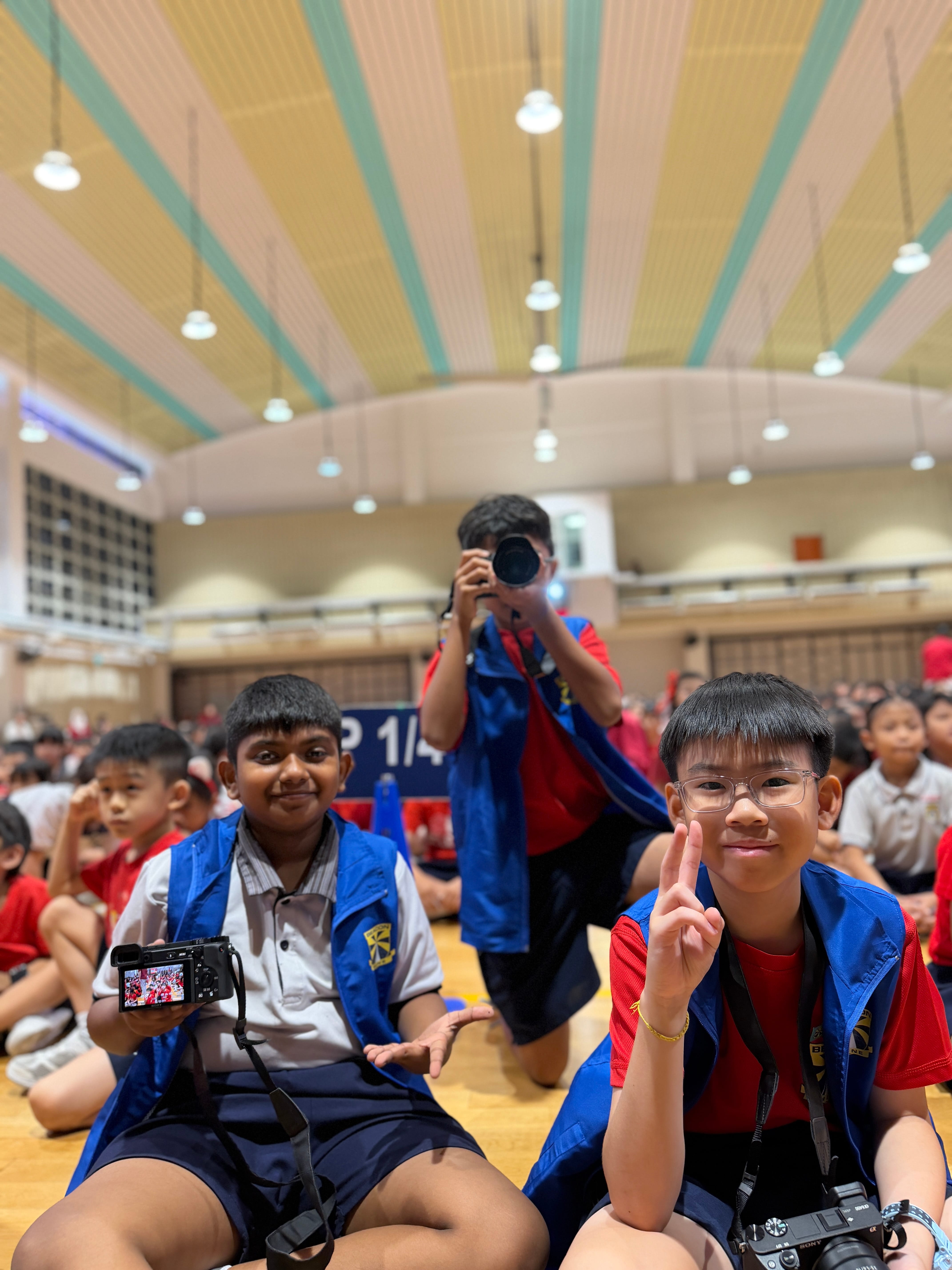 📸 The Eyes Behind the Lens: A huge shoutout to our dedicated student photographers working hard behind the scenes to capture every vibrant moment of our National Day celebration! 🌟👏 